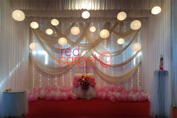 pink & white theme decor with hanging lights 