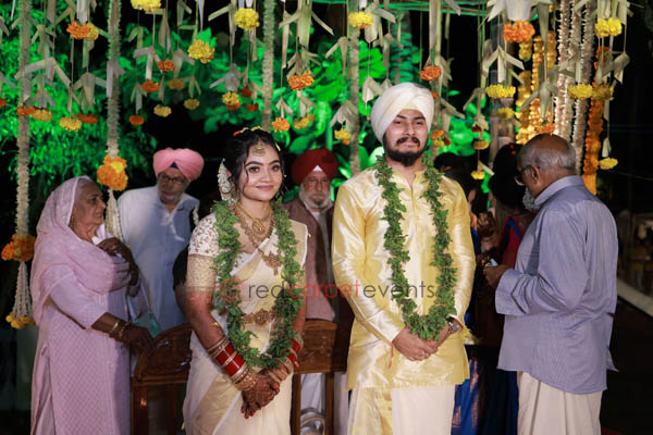 The sikh nair couple in kerala attire 
